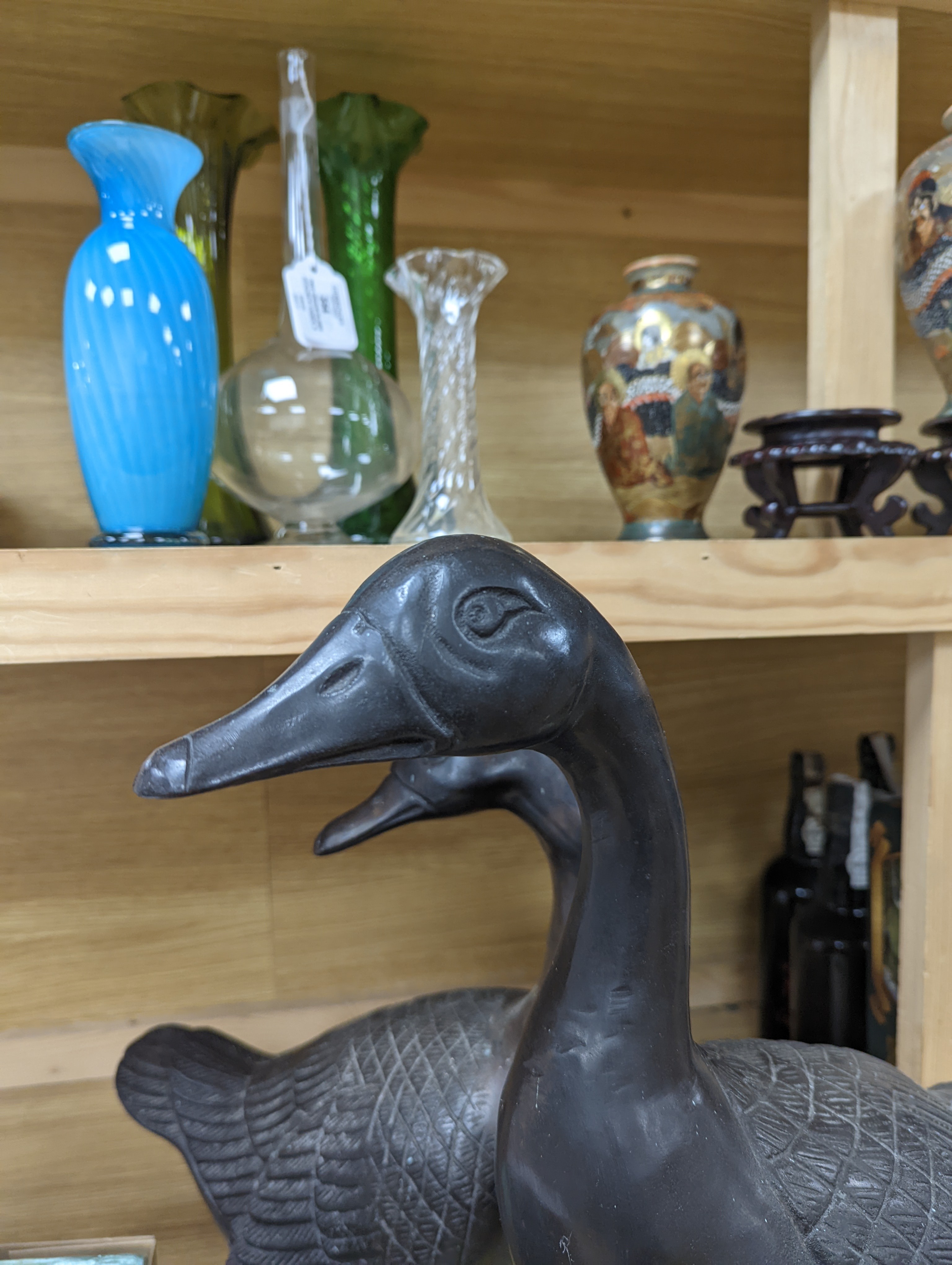 A pair of modern Chinese bronze models of geese, largest 48cm